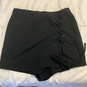 Never before worn black shorts.